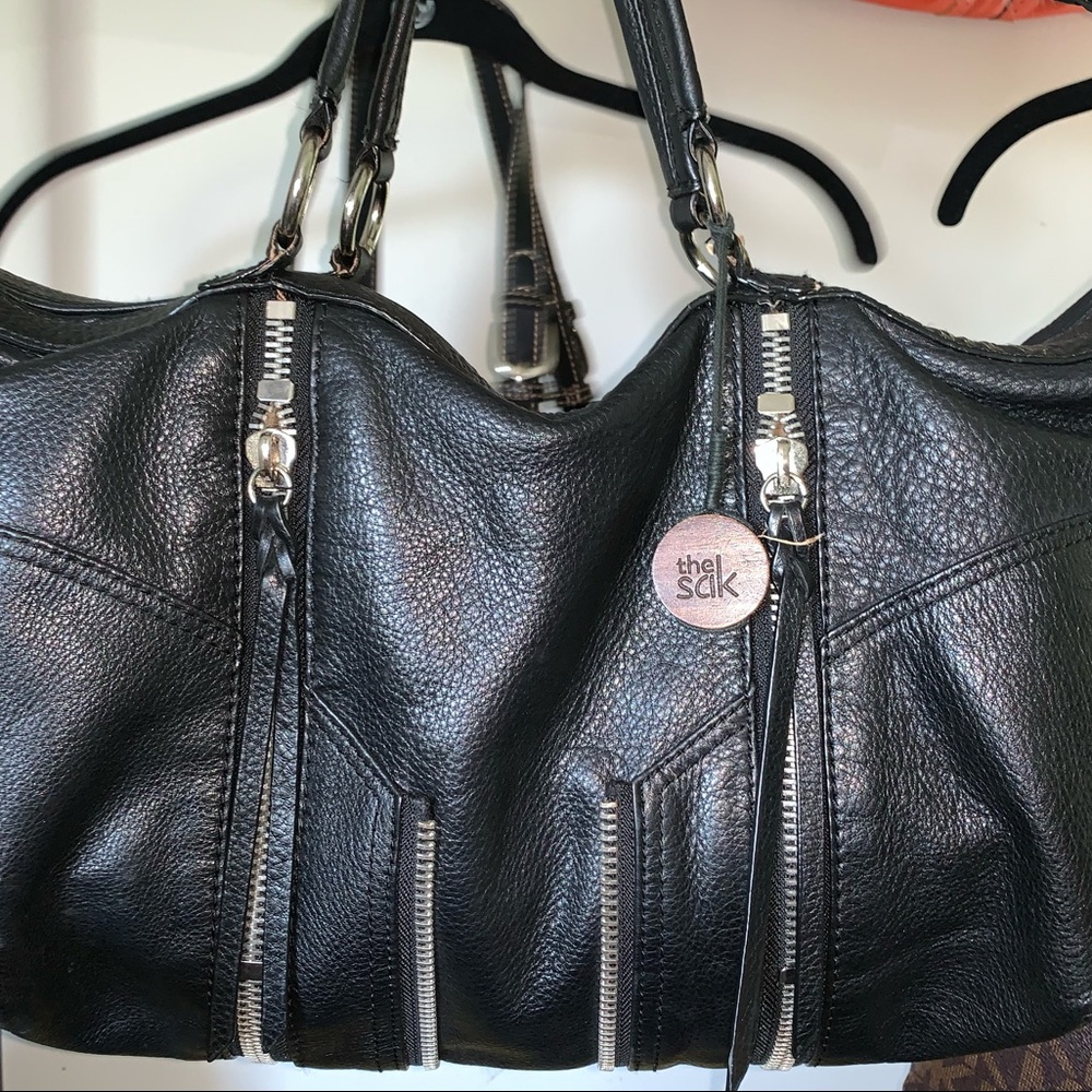 The Sak  thick, black, velvety leather.